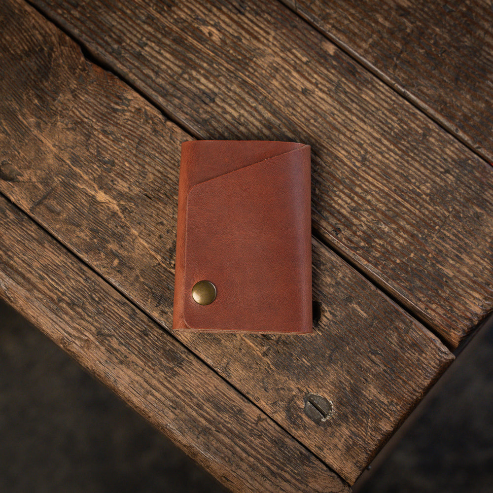 Handmade minimal leather Rollout Wallet has a single pocket for cards, and nicely rolls your cash and secures with a snap